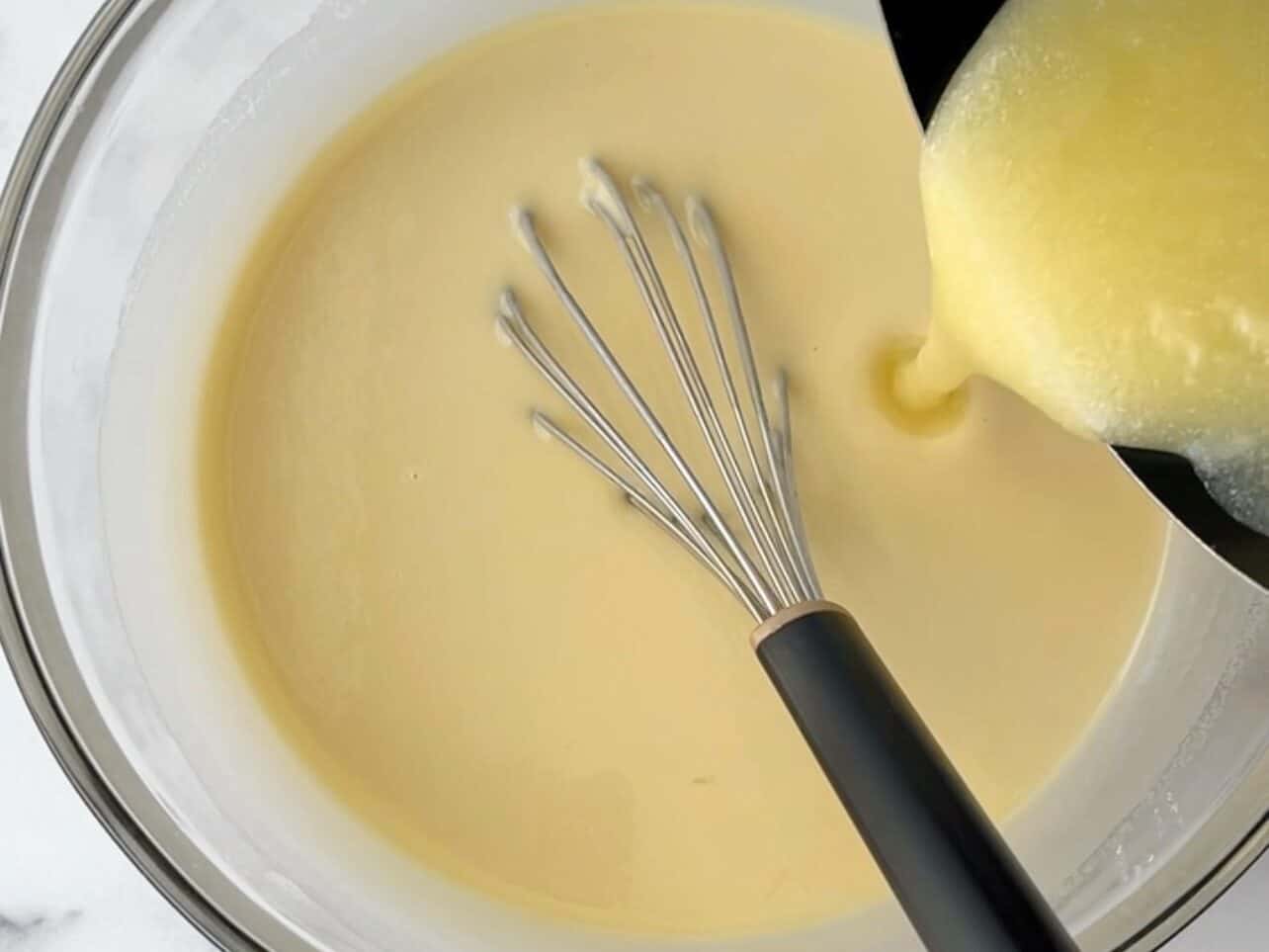 Pour melted cooled butter into the batter
