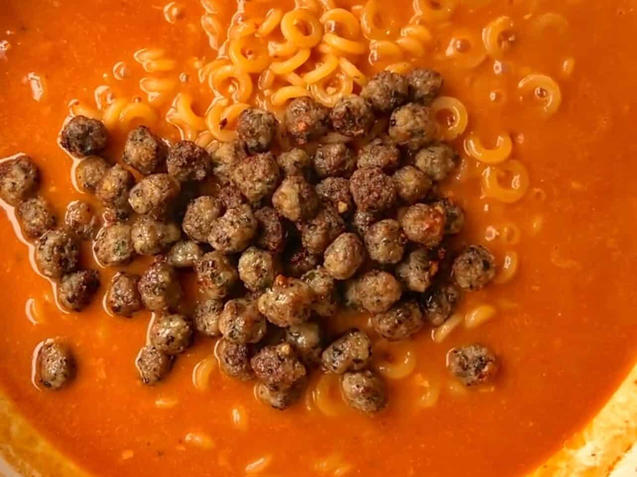 add meatballs back in pan