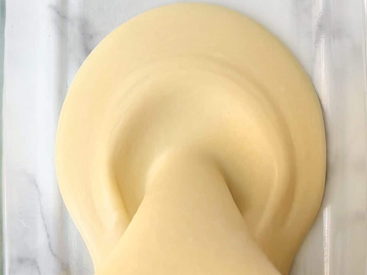 Butter mochi batter poured in greased pan