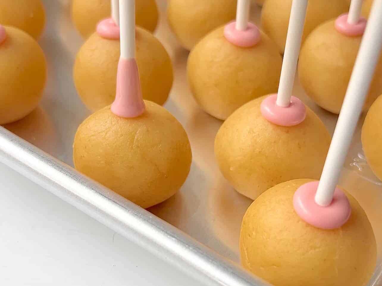 Push dipped sticks halfway through center of each cake ball