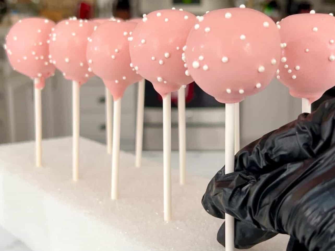 Use a styrofoam block to keep cake pops upright while they dry