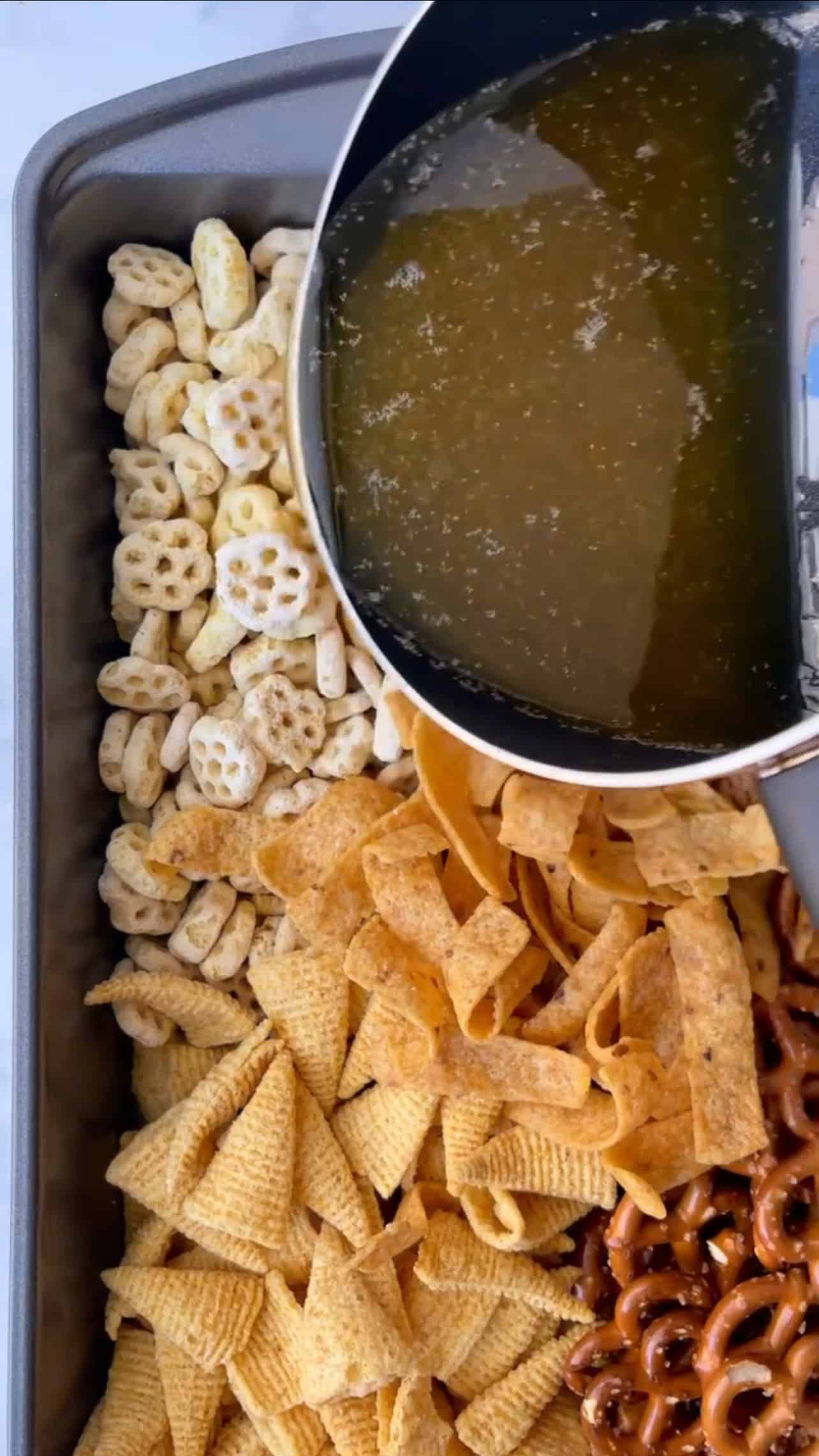 Pour butter-soy sauce syrup to coat chips and cereal.
