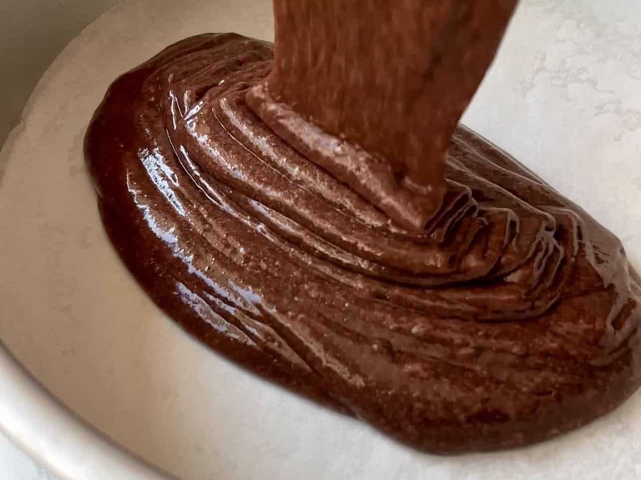 pour cake batter into greased lined pan