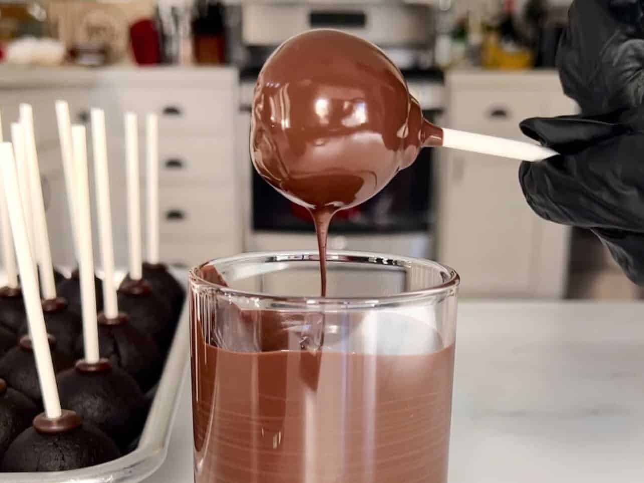 tap cake pop to let excess candy melt drip off