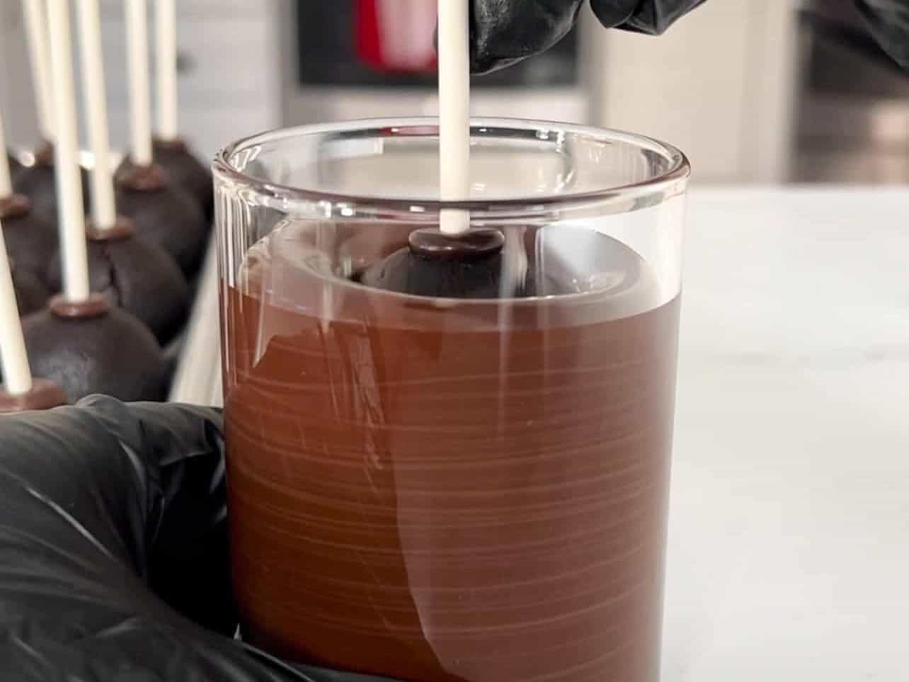 submerge entire cake pop in melted candy melt