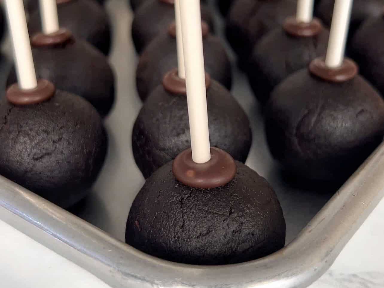 chill cake pop in freezer to help adhere to stick
