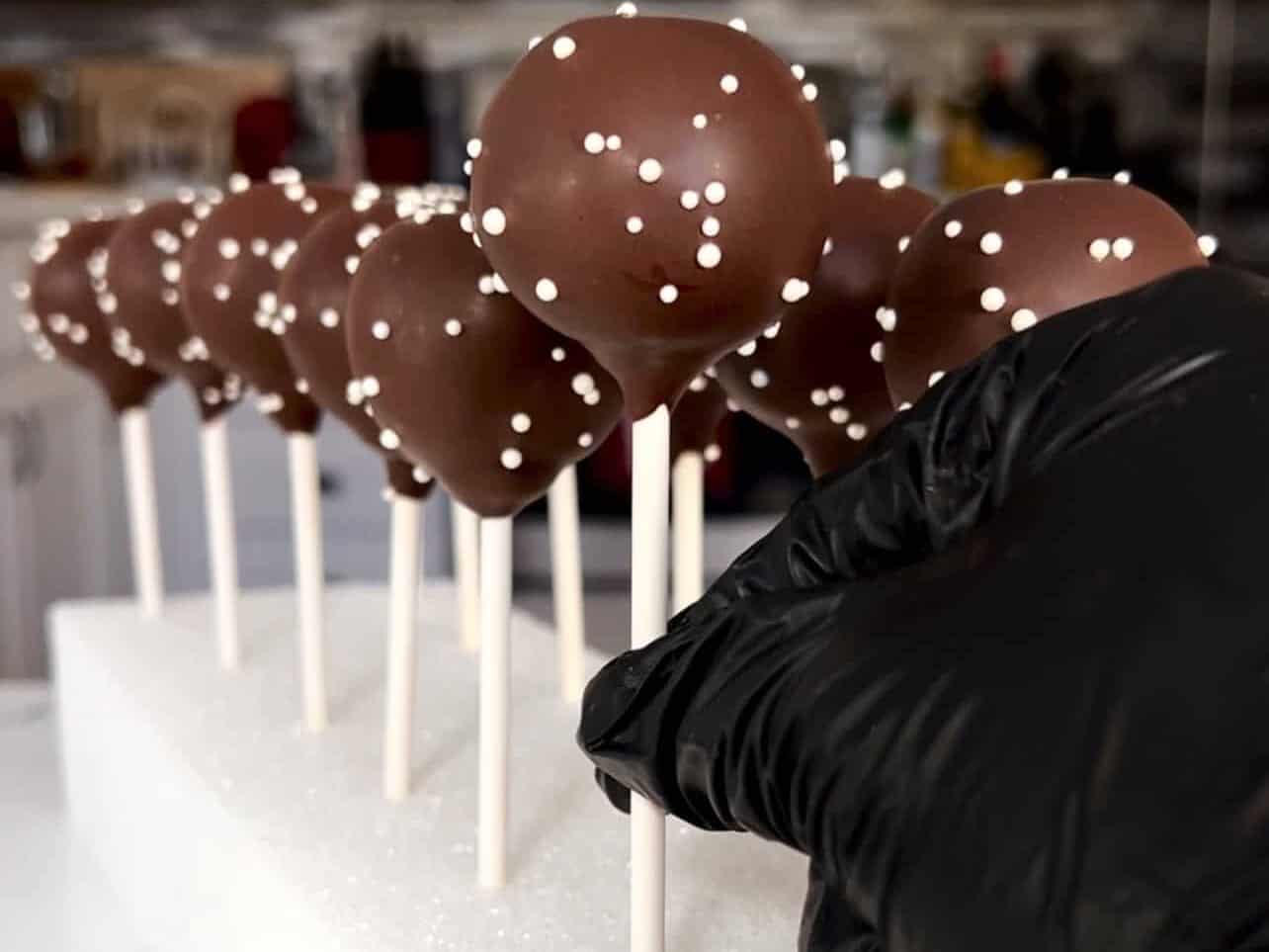 finished Starbucks copycat chocolate cake pops drying on styrofoam block