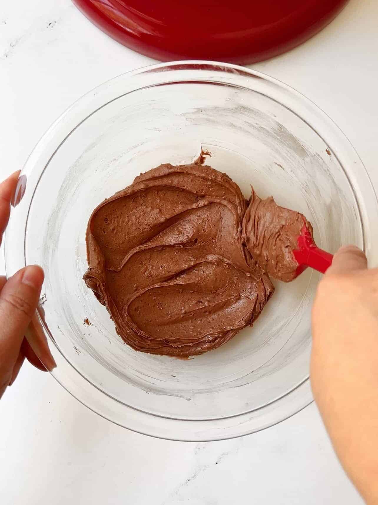 adding chocolate buttercream to make Starbucks copycat chocolate cake pops
