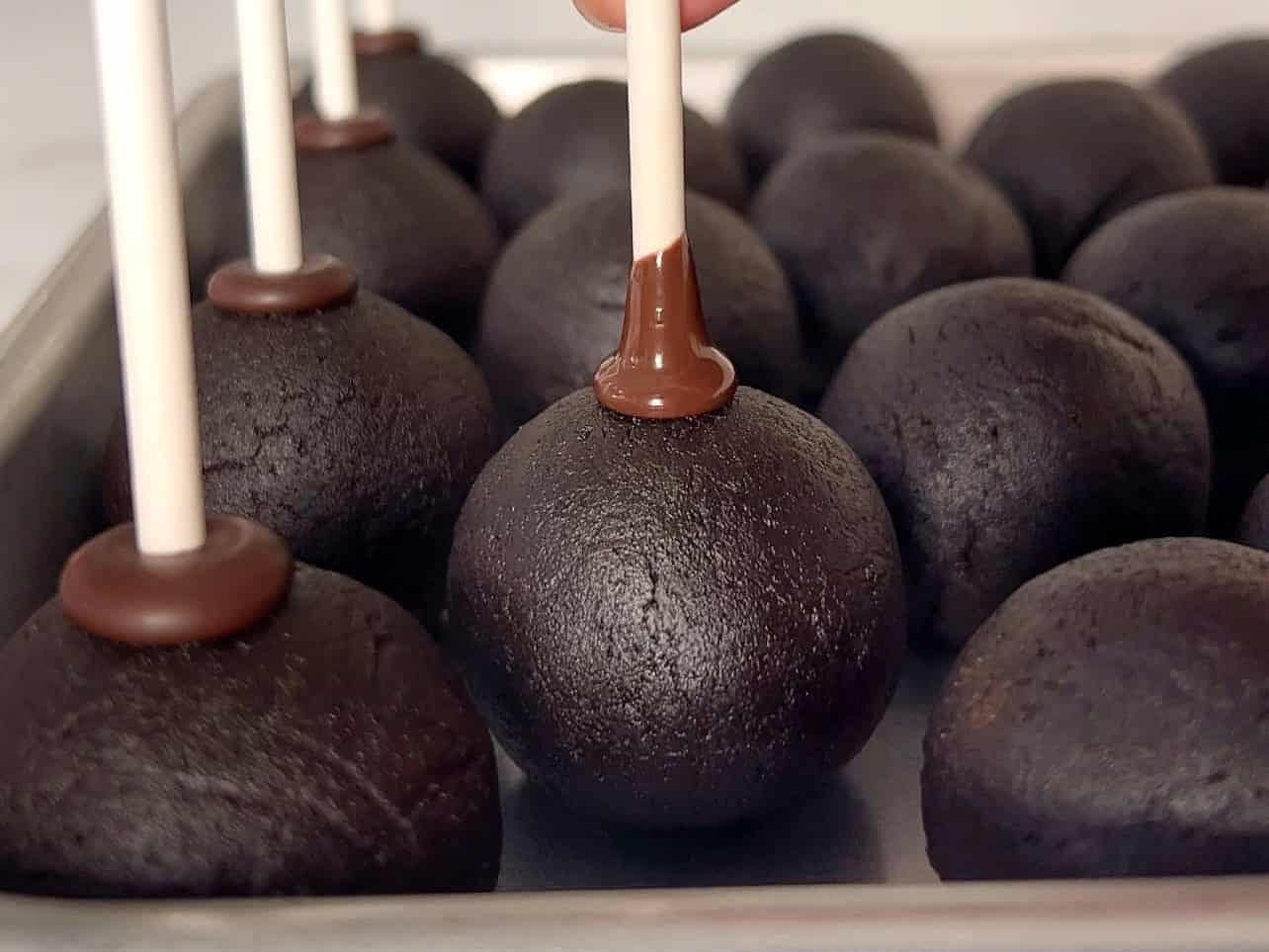 insert dipped stick halfway through center of cake ball