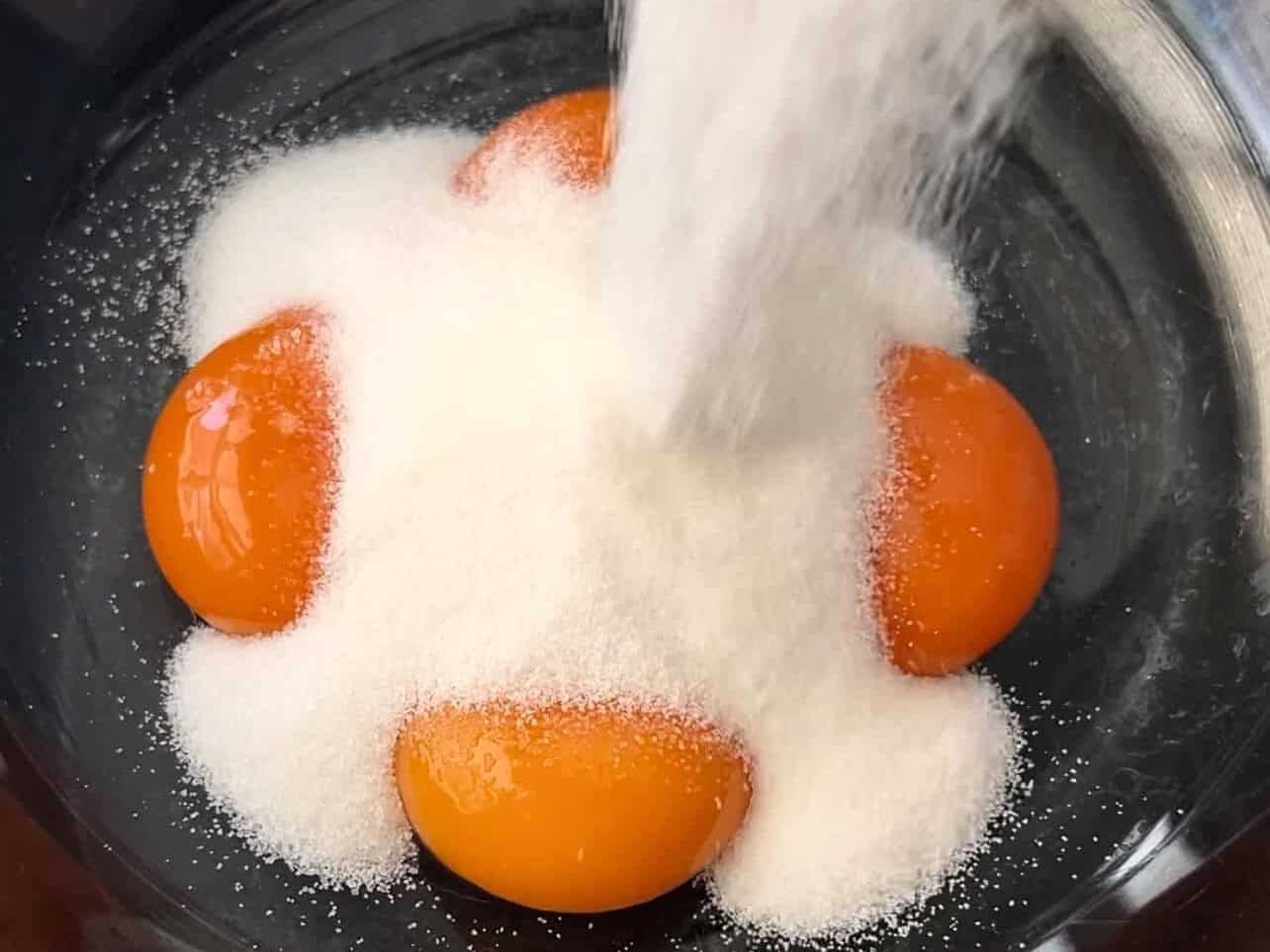 tempering eggs with sugar over a double boiler