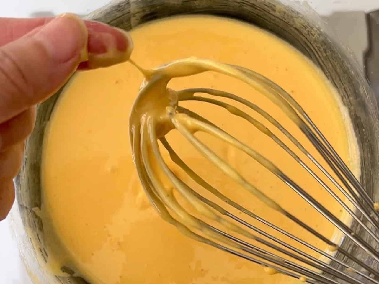 eggs are tempered when you don't feel sugar granules between your fingers