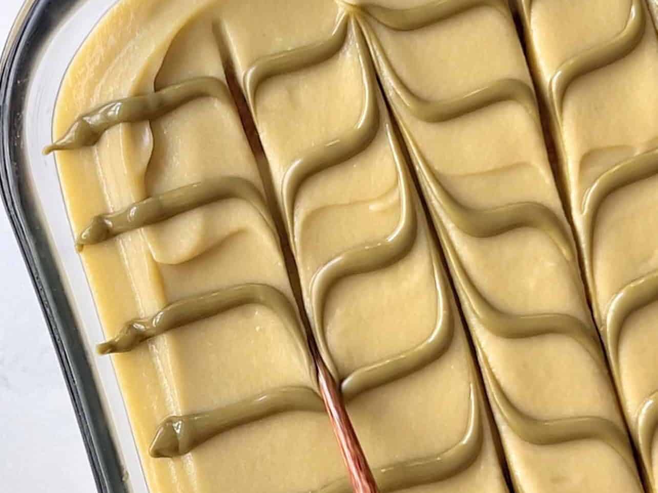 feather pistachio cream using a chopstick