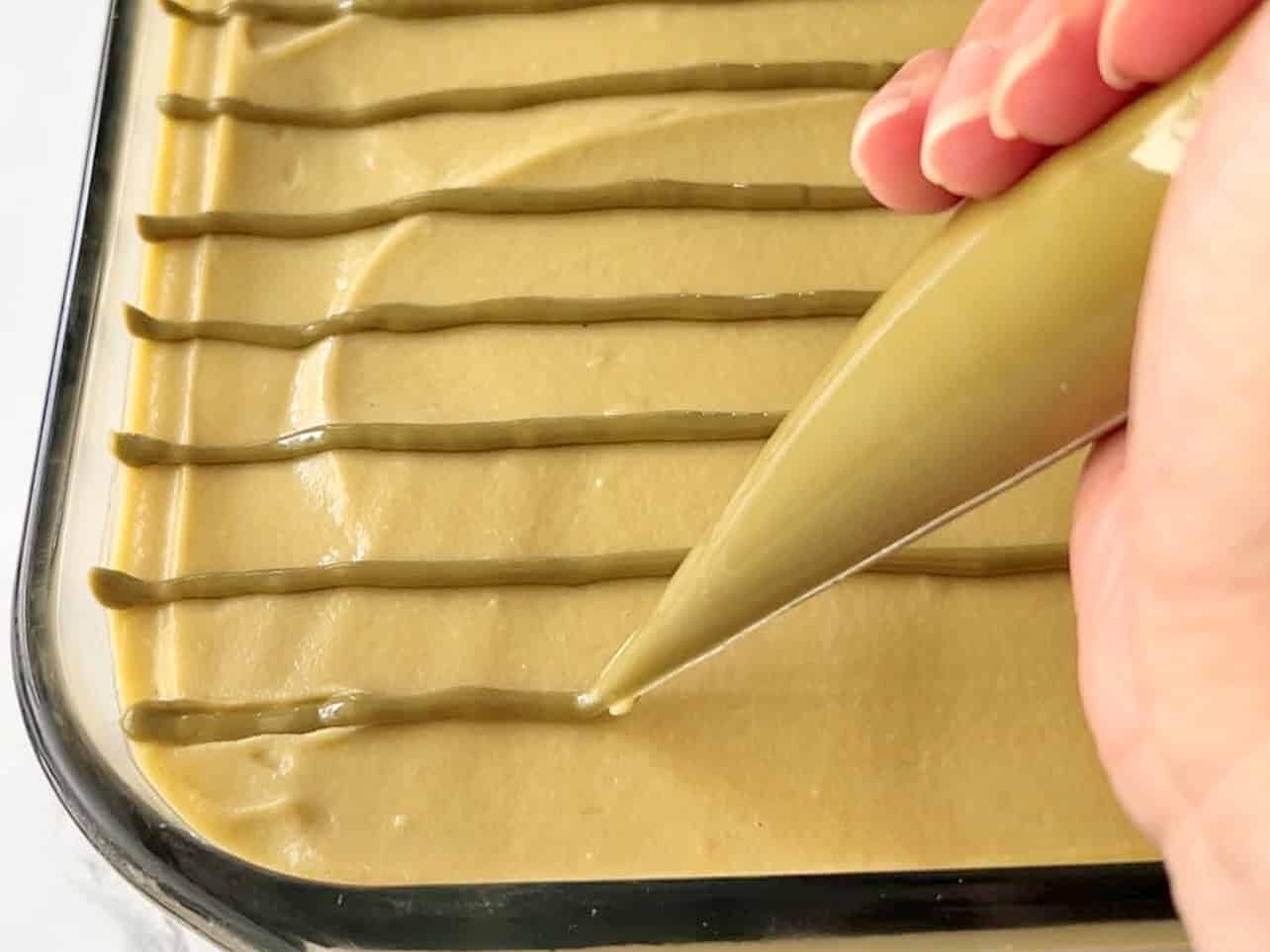 pipe pistachio cream as decoration for pistachio tiramisu