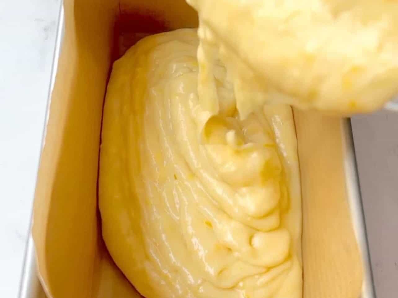 pour lemon loaf batter into greased/lined pan