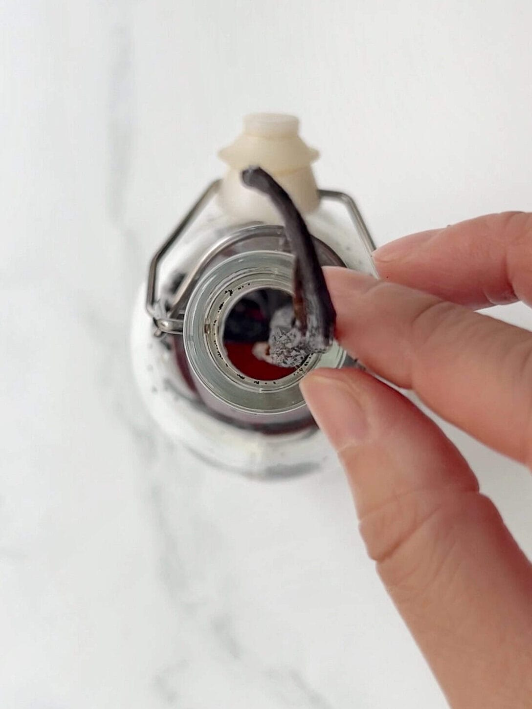 add scraped vanilla beans into extract jar