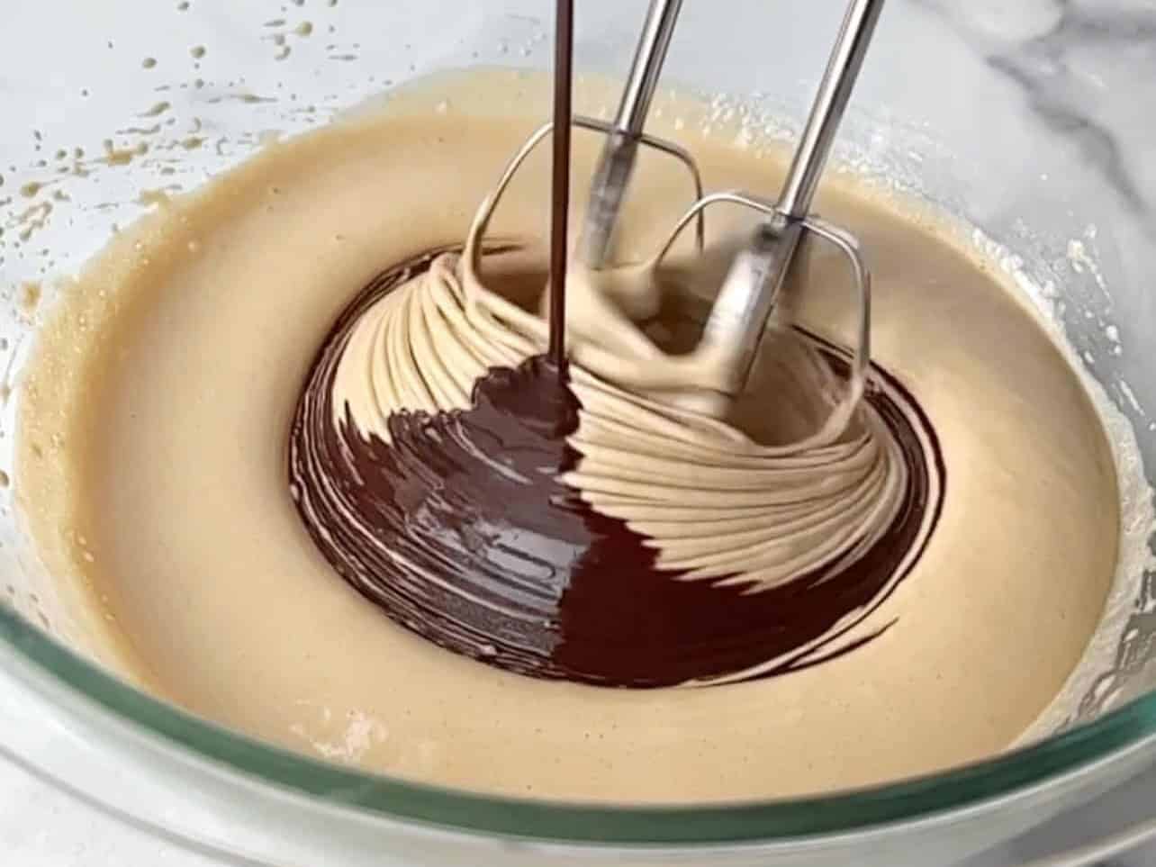 brownie cookie batter mixed with melted chocolate
