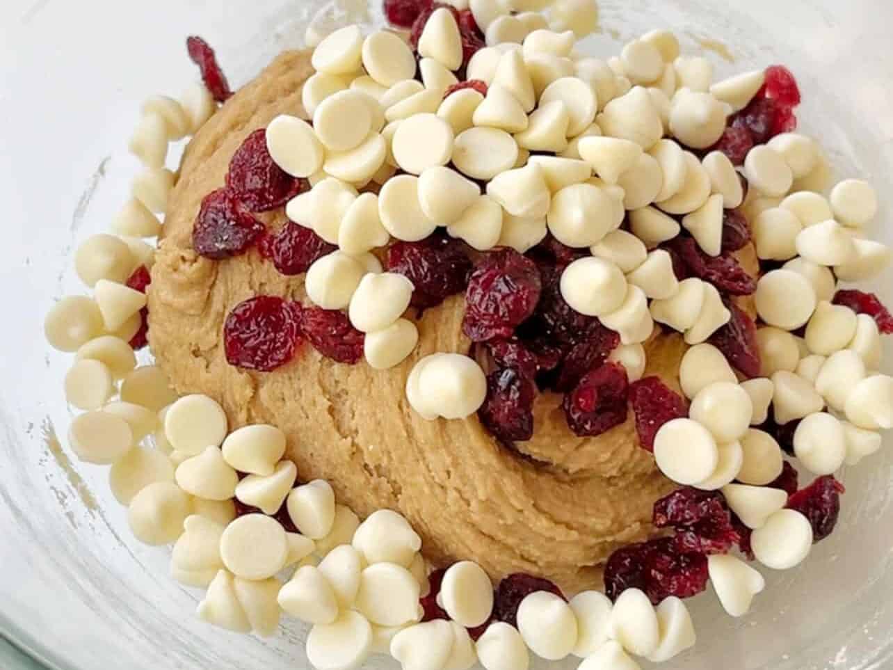 add dried cranberries and white chocolate chips to batter