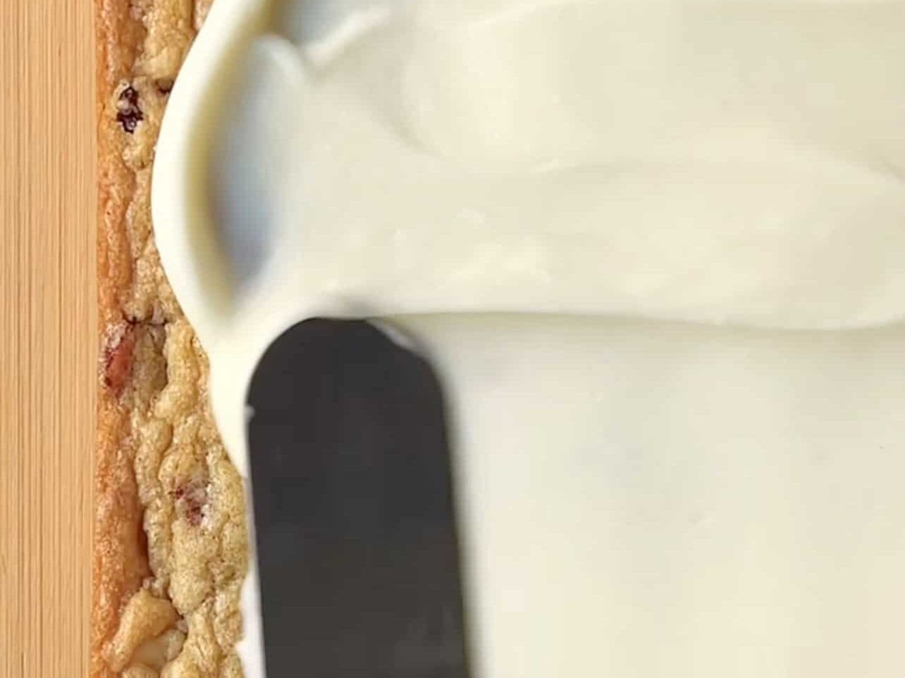 spread cream cheese frosting evenly