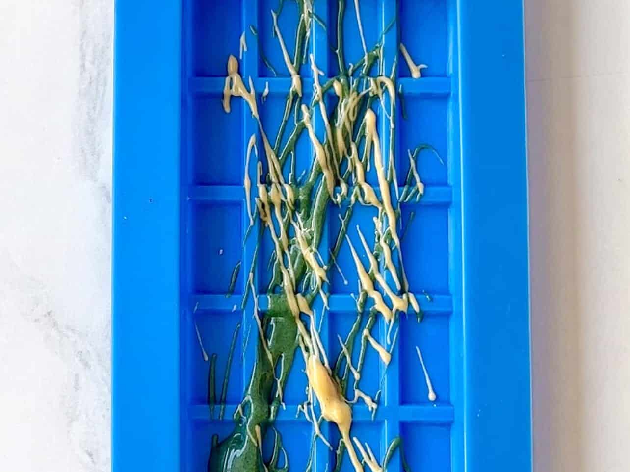 chocolate mold with decorative chocolate used for viral pistachio chocolate bar