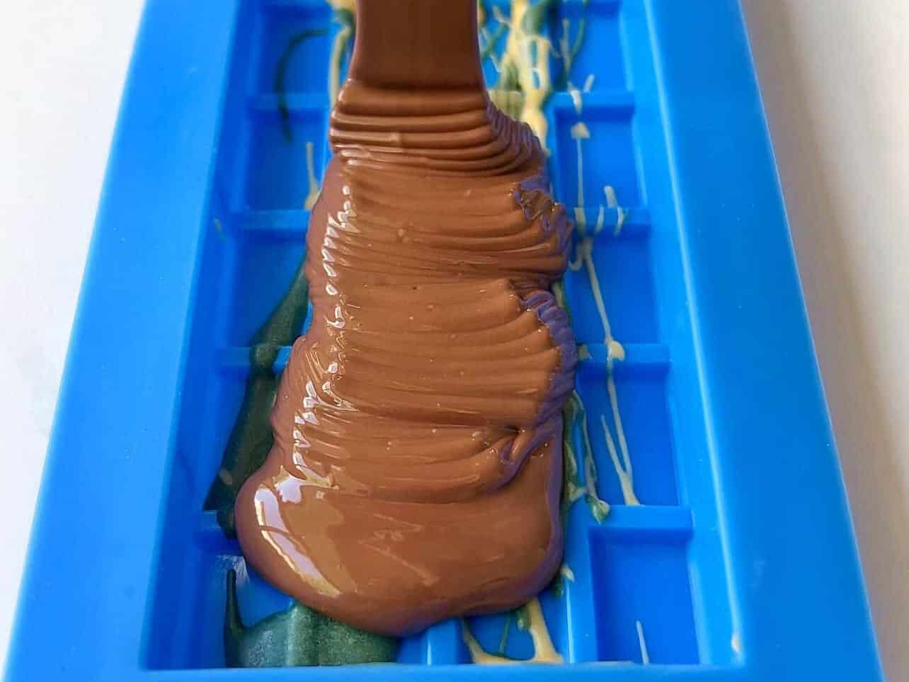 adding first layer of chocolate