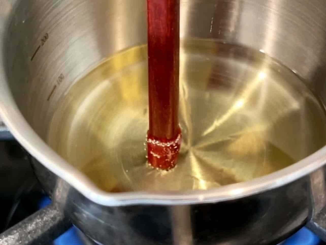 test hot oil with a wooden chopstick