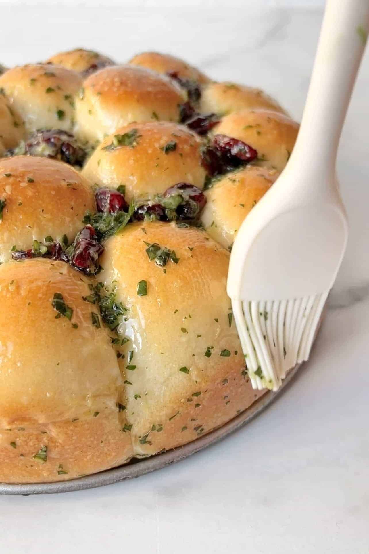 brush herb butter on garlic bread wreath