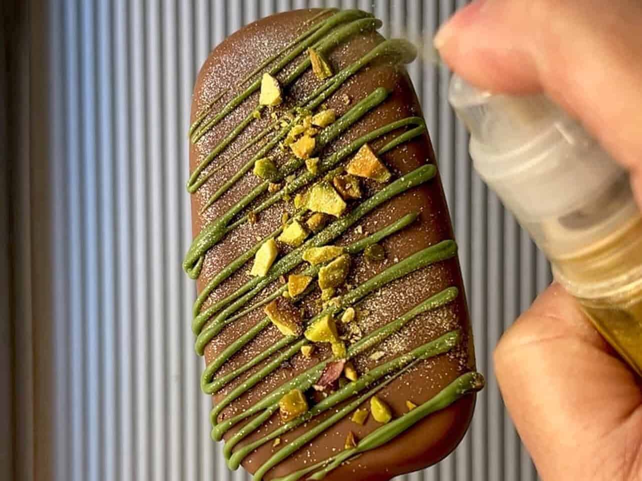 spray edible gold dust for final touch