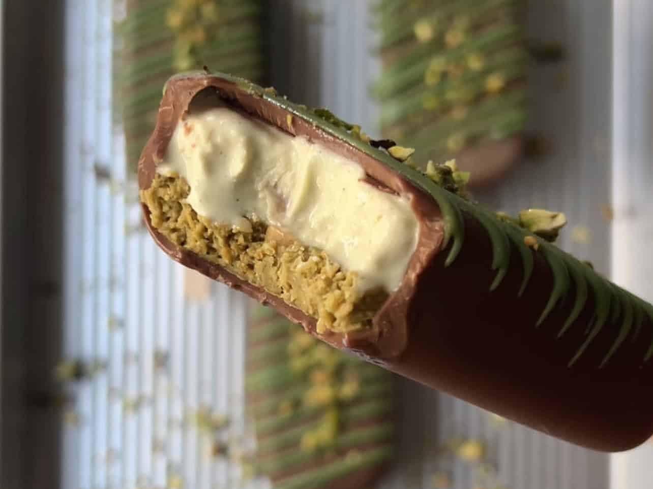 taking a bite of homemade Dubai pistachio ice cream bars
