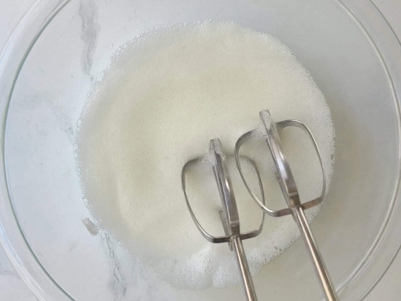 whip egg white until soft peaks