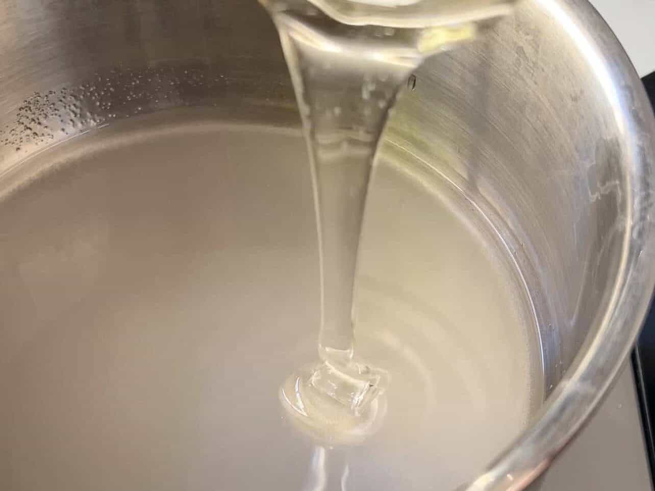 combine water, sugar, and corn syrup to make syrup for marshmallow