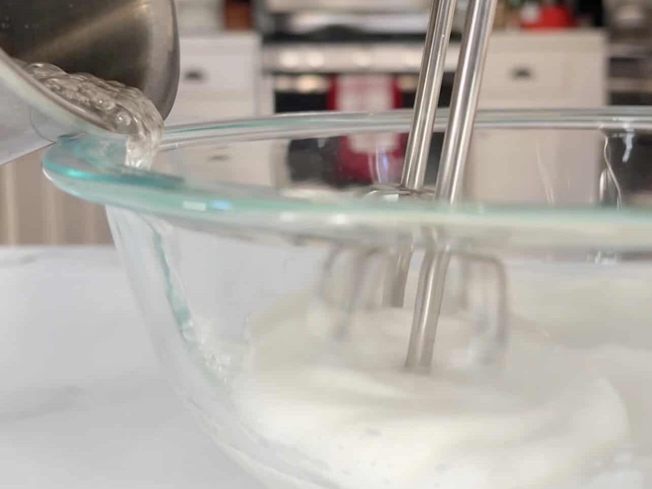 stream hot syrup as you whip egg whites