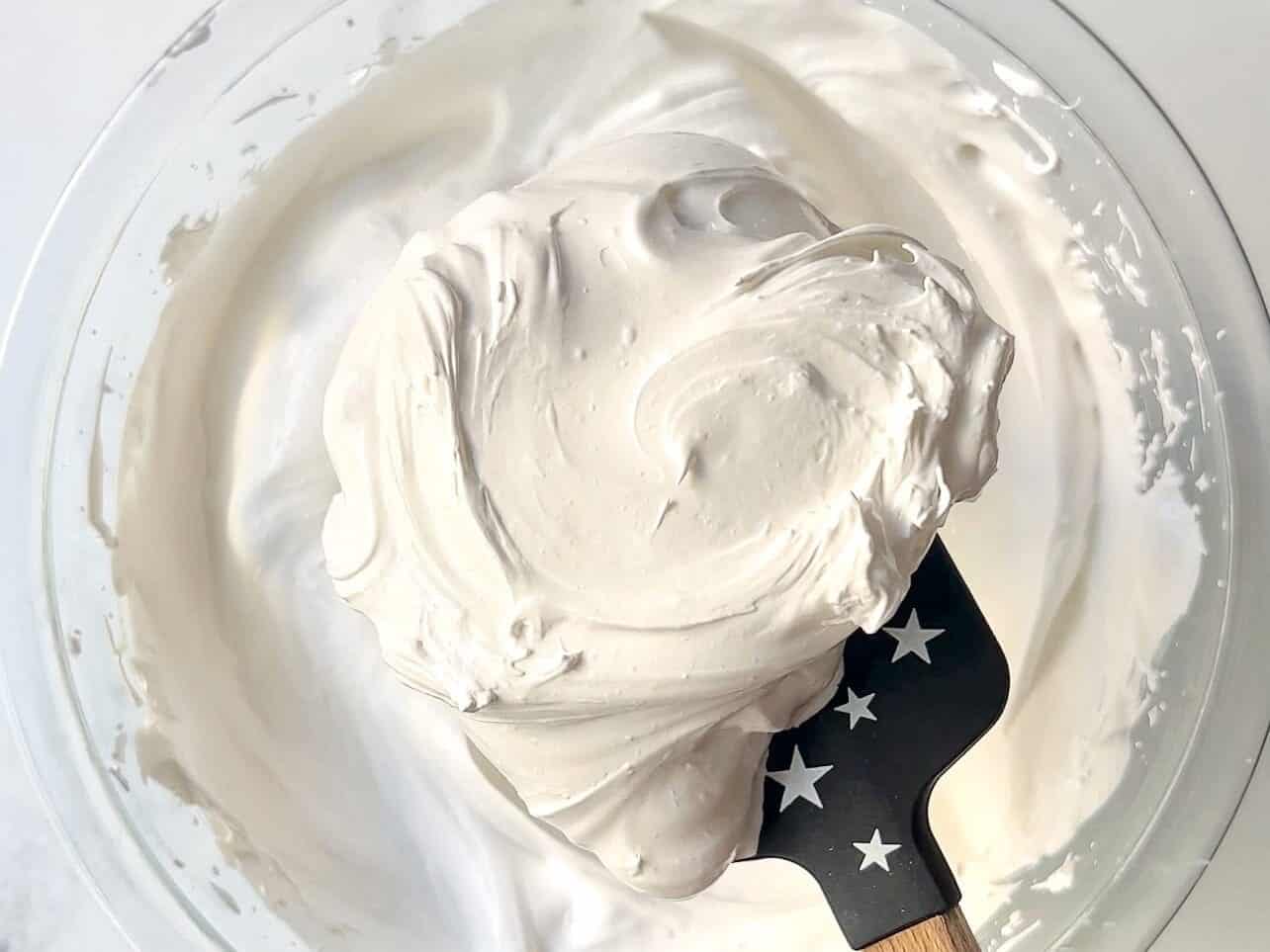 whip until marshmallow fluff is thick and stiff peaks,