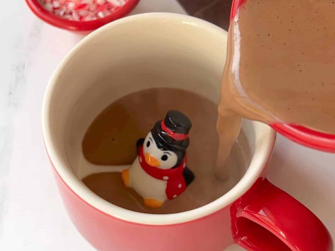 pour hot cocoa into mug