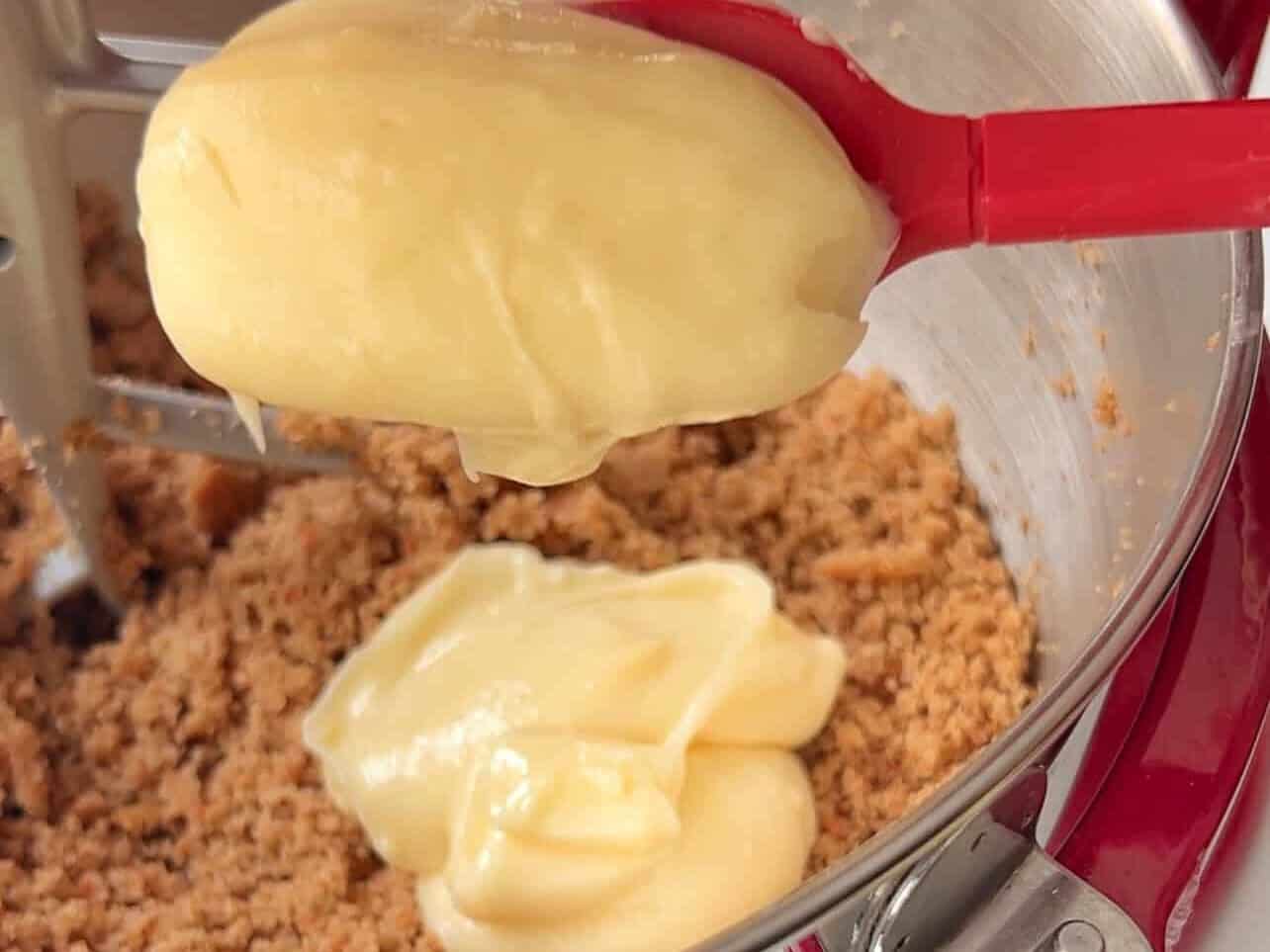 combine frosting with crumbled cake