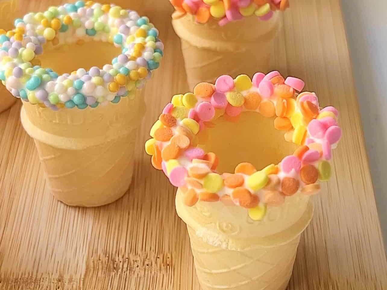 decorating ice cream cones with sprinkles