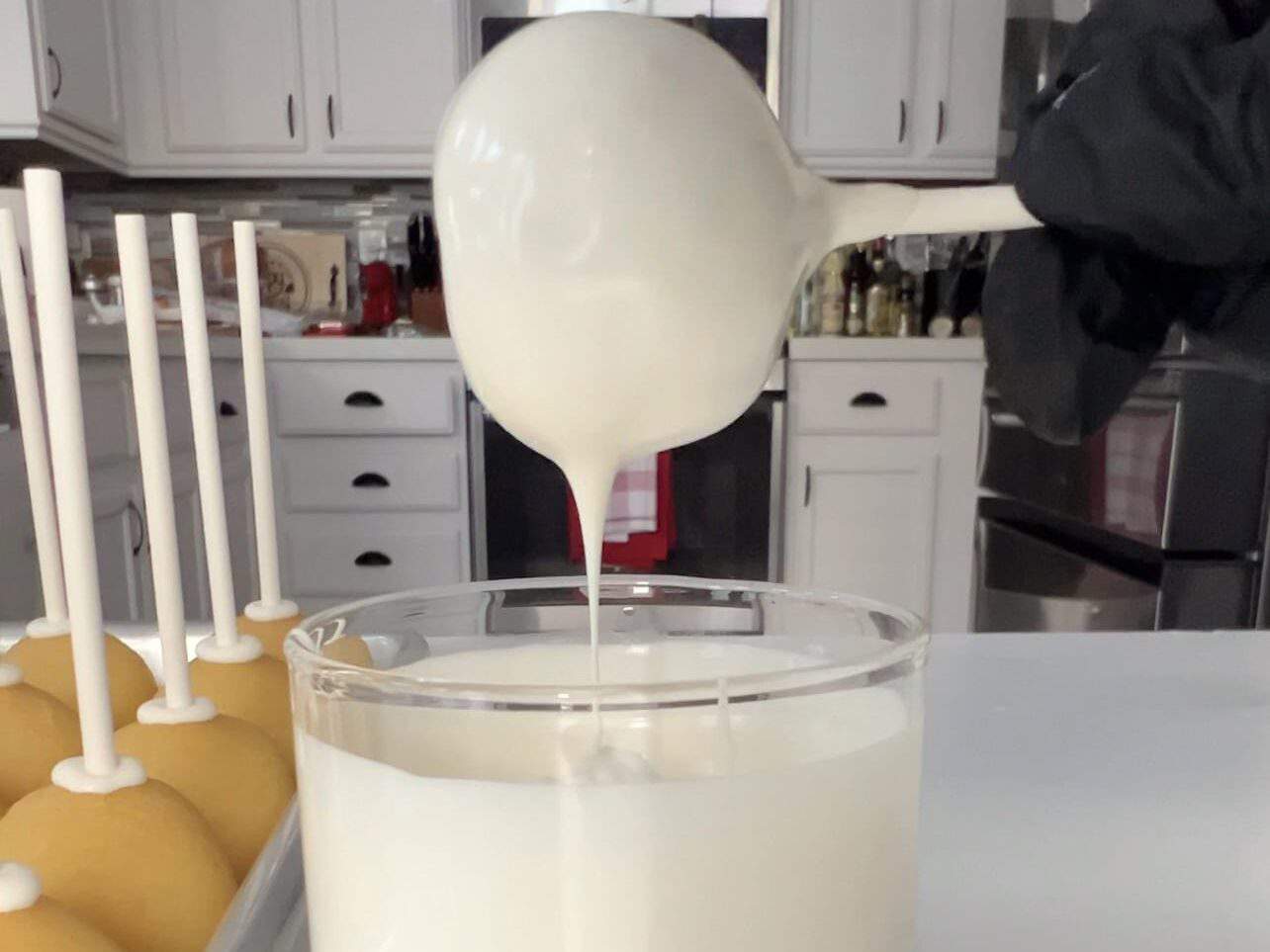 tap cake pop gently to allow excess candy melt to drip off