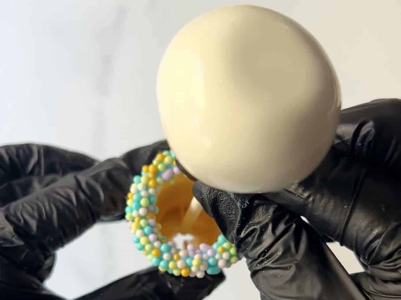 gently insert cake pop into decorated cone