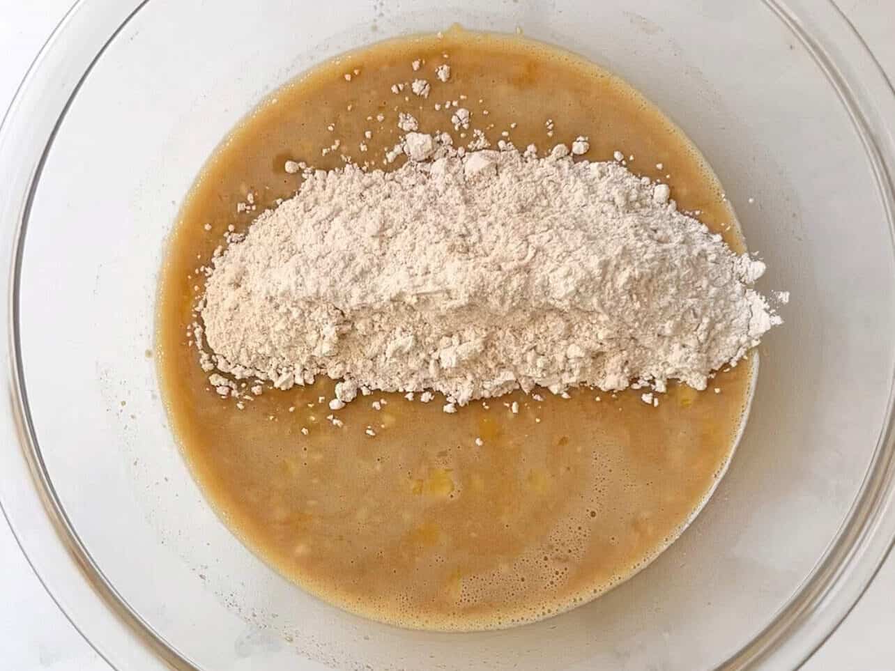 combining dry and wet ingredients for carrot cake cupcake batter