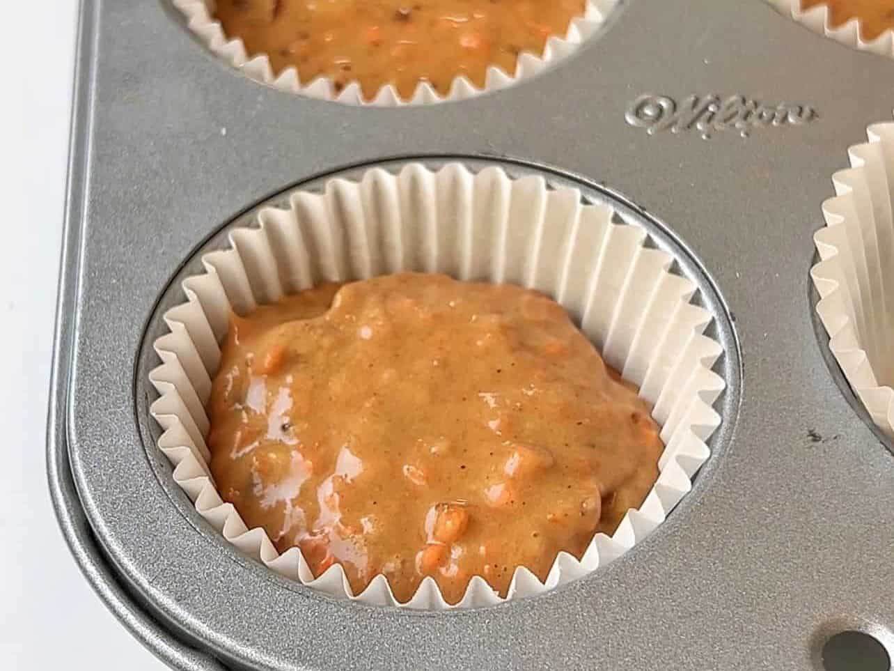 carrot cake batter in cupcake liners