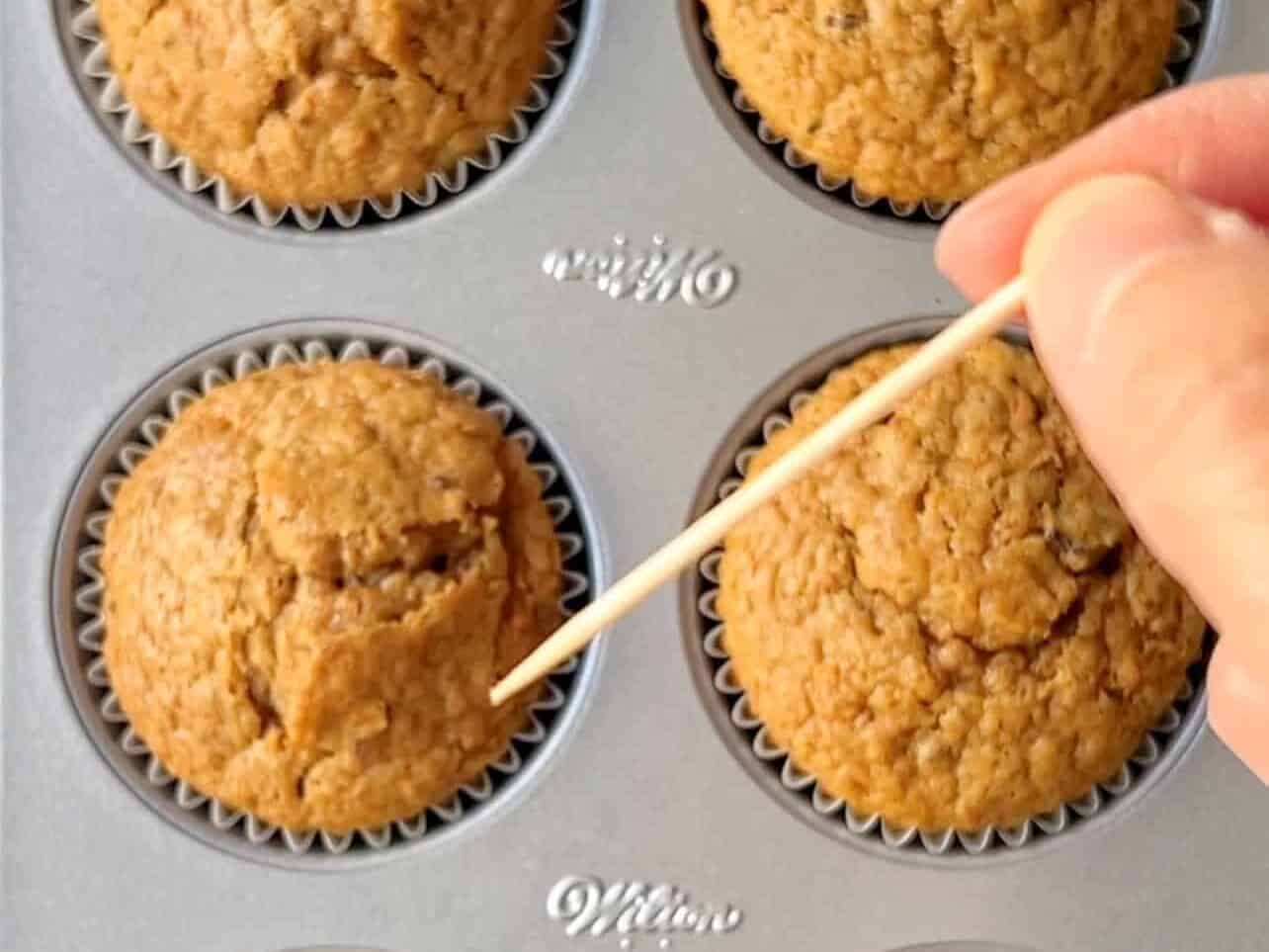 check cupcake doneness by poking a toothpick to check if it comes out clean