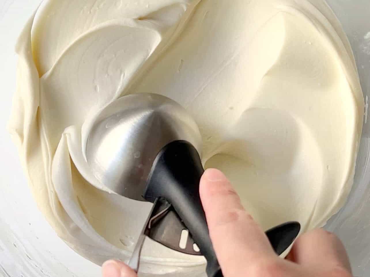 use an ice cream scooper to dollop frosting