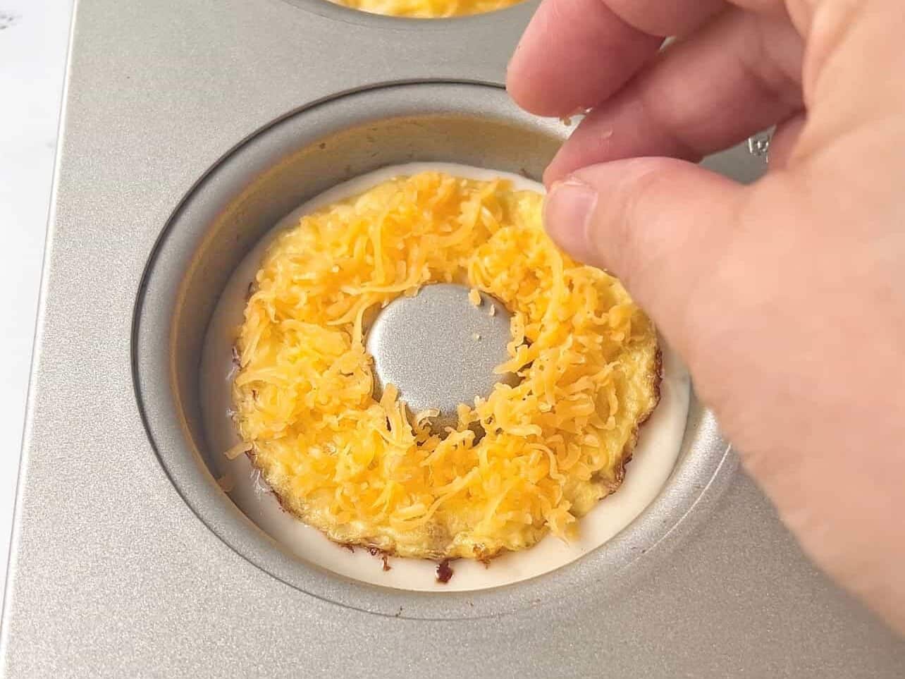 add grated cheese to breakfast donuts