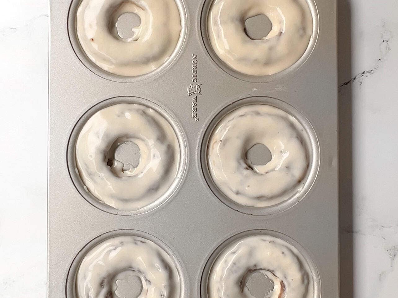 cover donuts with remaining pancake batter