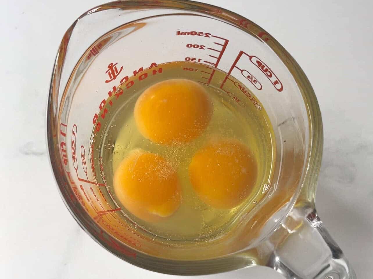 scramble eggs in spouted measuring cup