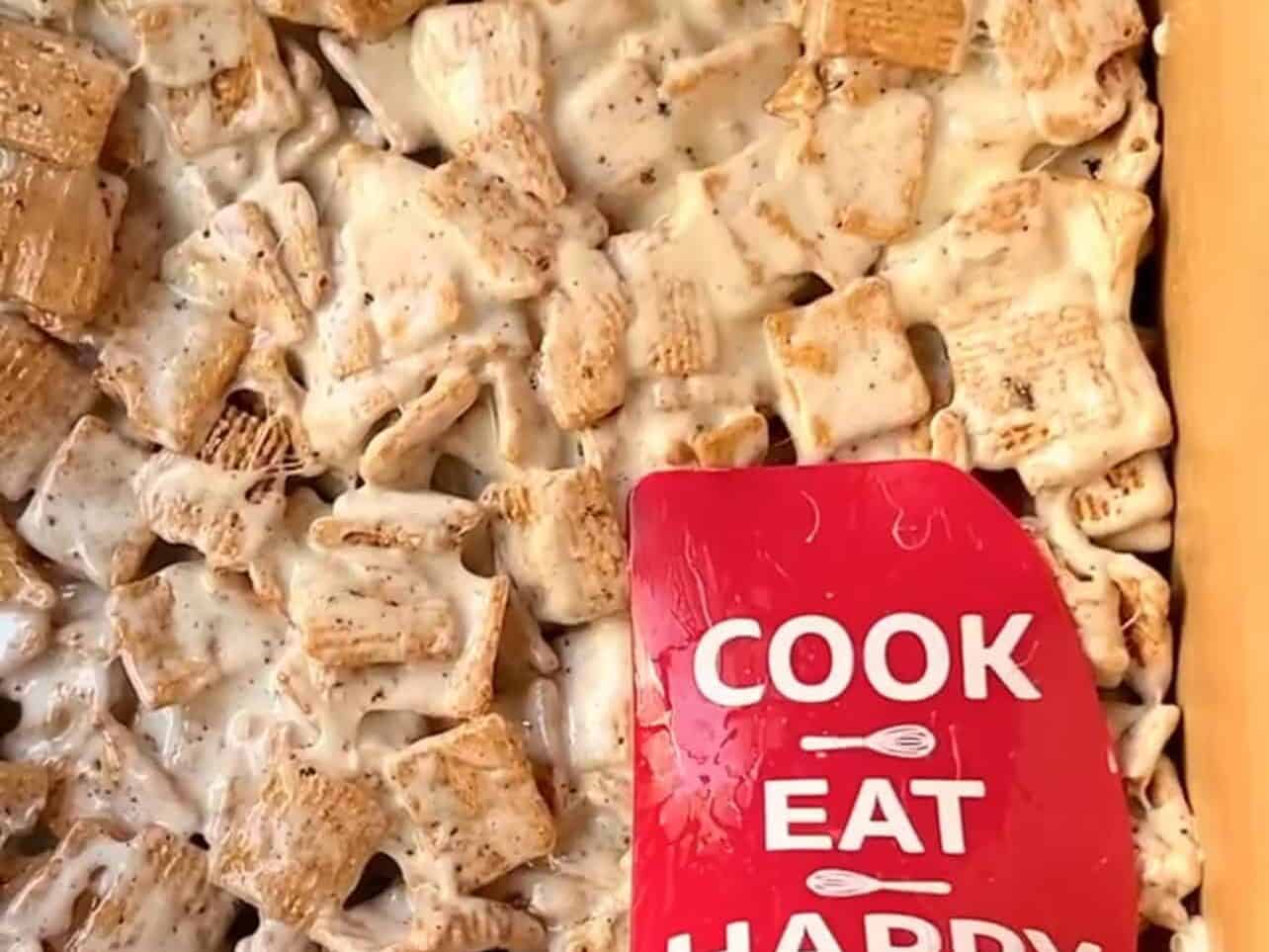 adding s'mores cereal treat to pan