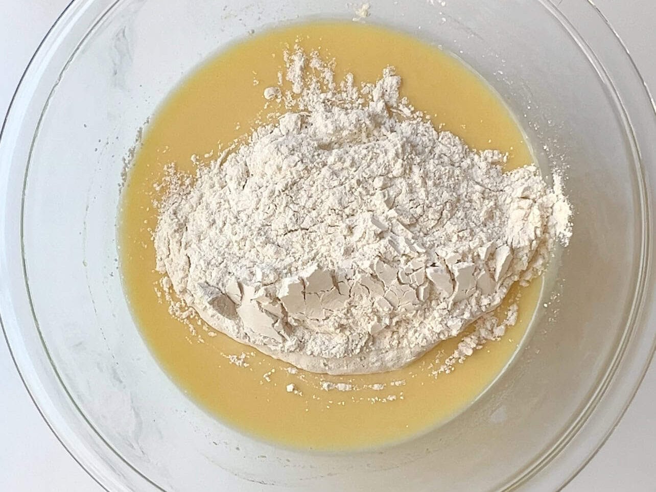 combine dry ingredients into wet ingredients in a mixing bowl