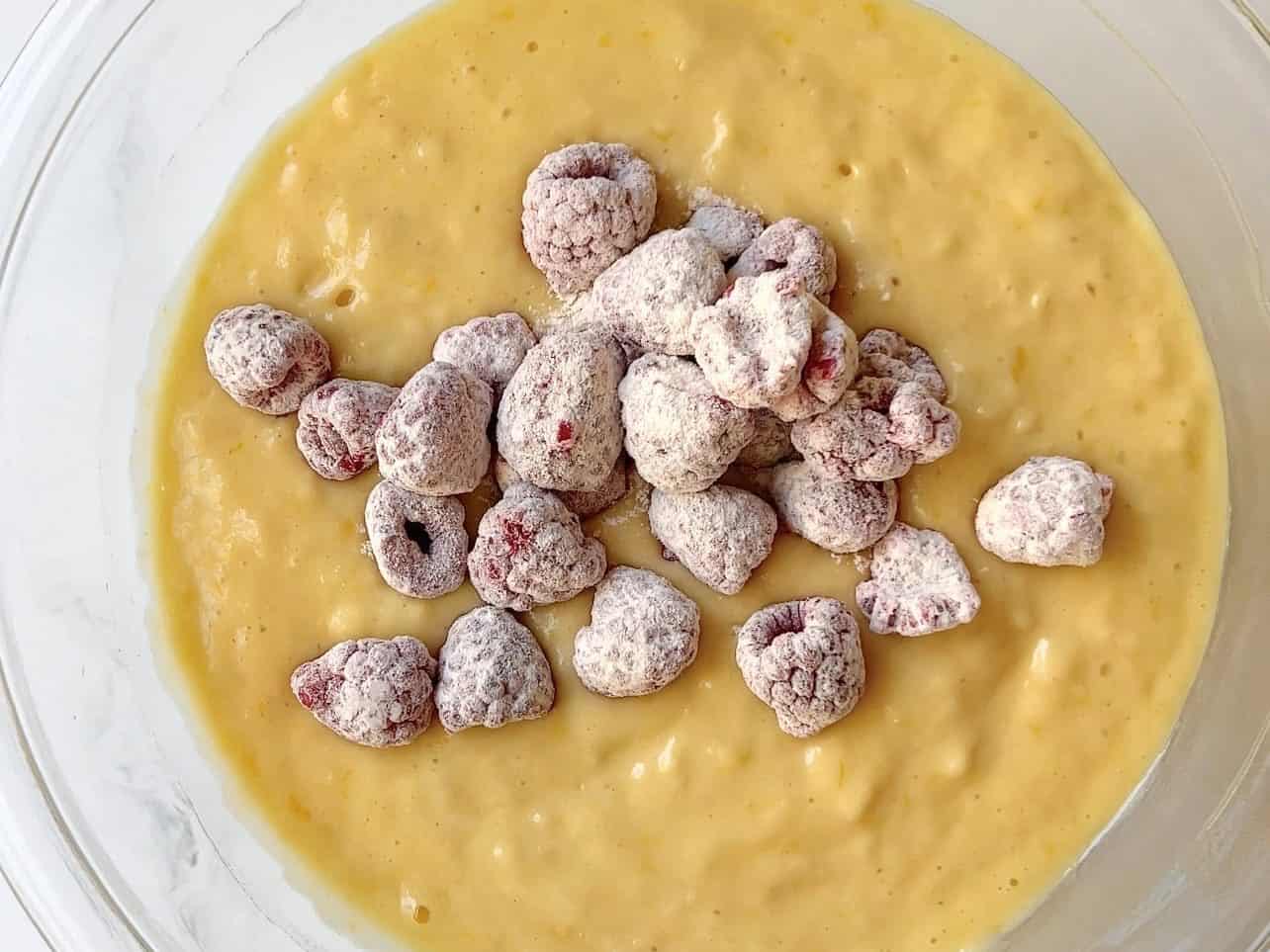 add floured raspberries into cupcake batter