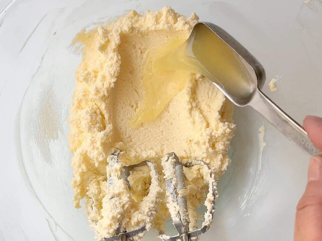 add lemon juice, vanilla and lemon extract, and salt to lemon cream cheese frosting