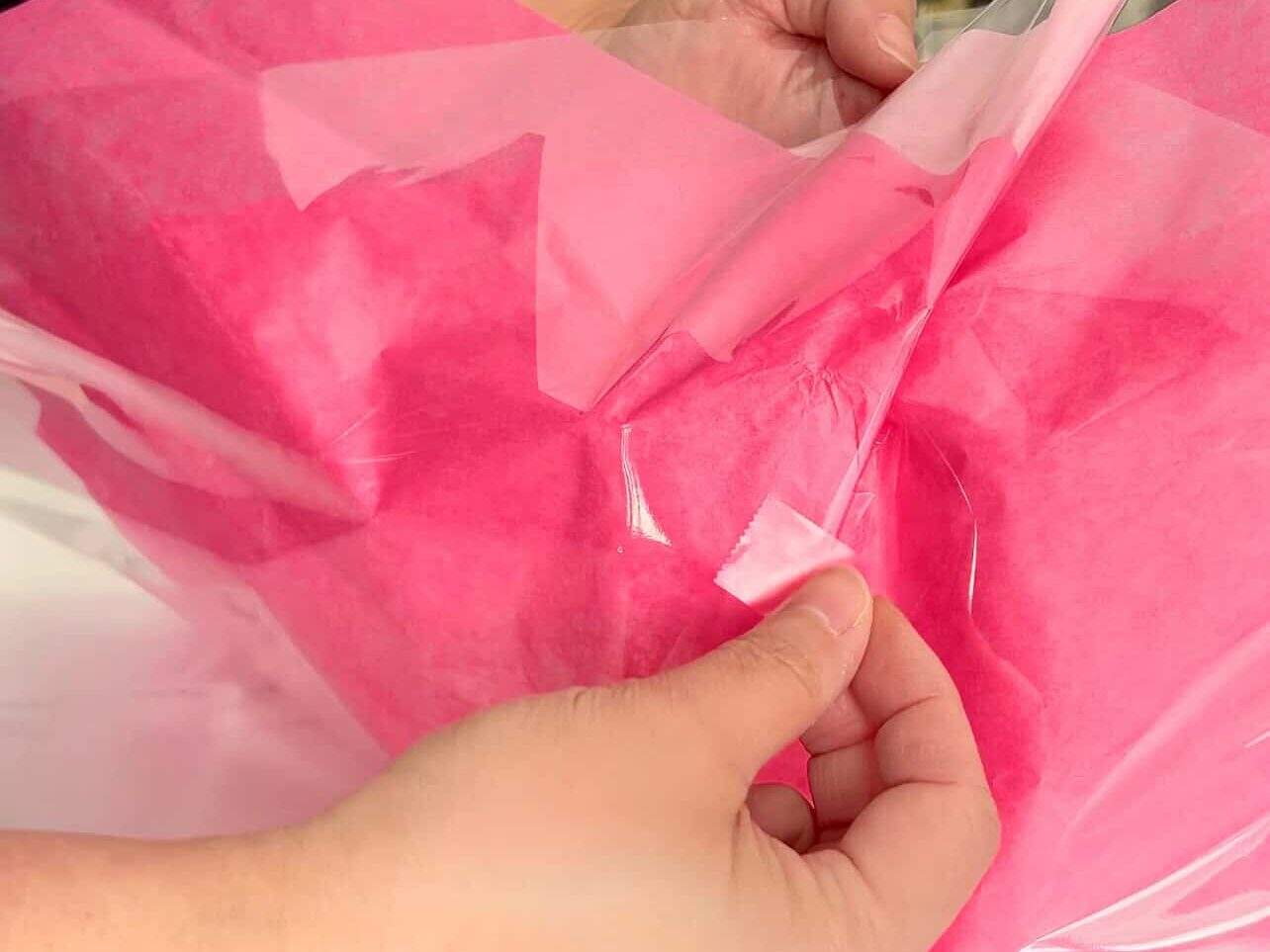 gather cellophane and tissue paper to wrap similar to a flower bouquet