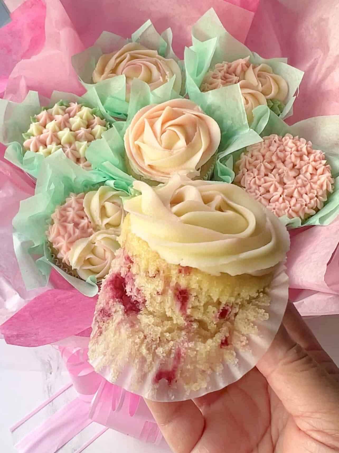 pink and white lemon raspberry cupcakes arranged in a bouquet
